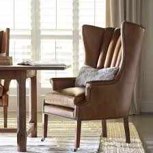 tufted leather wingback chair with high