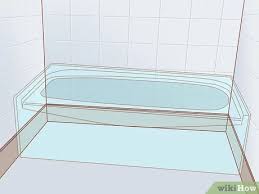 In this demonstration, the tiles are attached to backer board. How To Install A Bathtub With Pictures Wikihow