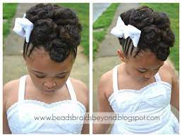 Touch device users, explore by touch or with swipe gestures. Cornrow Cinnabun Updo Natural Hair Updo Natural Hair Styles Flower Girl Hairstyles