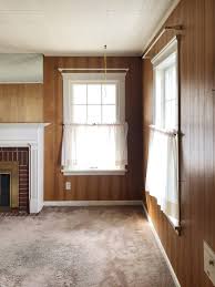 See This Dated Wood Paneled Living Room