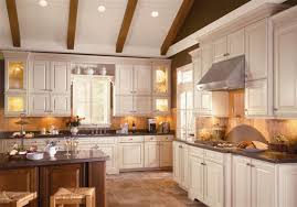 mixing finishes like american woodmark s savannah maple erscotch on the main cabinetry and savannah cherry