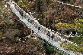 Crossing one of many suspension bridges. - Picture of Simrik Real Nepal  Treks & Expeditions, Kathmandu - Tripadvisor