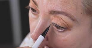 woman applying makeup stock video