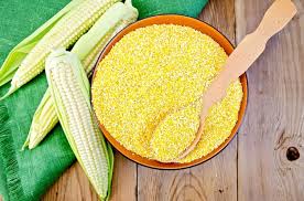 corn grits in a bowl with a spoon corn