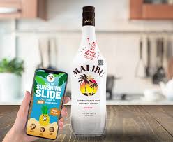 Malibu is based on rectified white barbados rum blended with natural coconut extracts and presented in a iconic opaque white bottle with the palm tree logo. Malibu Rum Unveils Connected Bottle With New Nfc Technology Bevnet Com