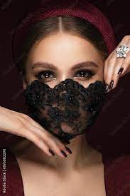 beautiful woman in a black lace mask