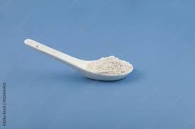 White Chemical Powder In Ceramic Spoon
