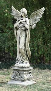 Garden Angel On Pedestal Holding Wreath