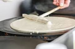 How are crepes traditionally served?