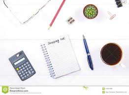 Notepad With The Text A Shopping List White Table With Calculator