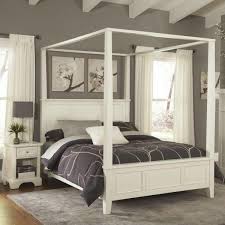 Finished in a weather beaten bark look, the straightforward modern styling of this piece help this bed to this item has been tagged as: Homestyles Naples White Queen Canopy Bed 5530 510 The Home Depot