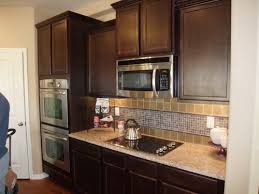 should i paint my dark kitchen cabinets??