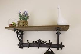 wooden wall shelf with cast iron coat