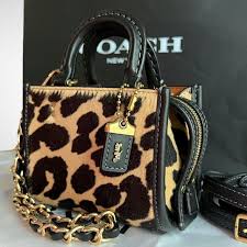 coach rogue 12 in haircalf with leopard