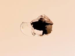 how to repair drywall patch a hole in