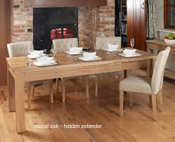 If your dining room is tight on space, a hinged dining table is the perfect solution. Baumhaus Mobel Hidden Extending Oak Dining Table Seats 4 8 Bargain Oak