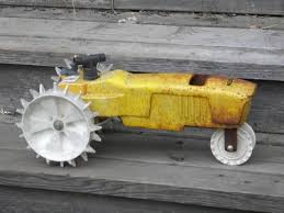 iron lawn tractor traveling sprinkler