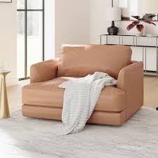 The overstuffed leather is soft and smooth, and the ottoman fits the chair so there is no loss in aesthetic continuity. Haven Leather Chair And A Half