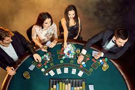 Poker Players Sitting Around A Table At A Casino Top View Stock Photo -  Download Image Now - iStock