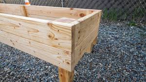 This raised planter box is simple to make and is perfect for keeping animals out of your garden. Diy How To Build Raised Garden Beds For Sloped Yard Using 2x6 Boards Youtube
