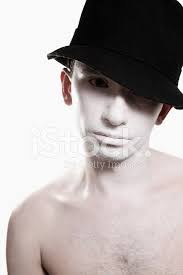 white makeup and black hat stock photo