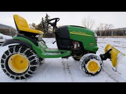 plowing snow with a lawn tractor you