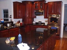 However, i would shy away from recommending you use the two colors together for your kitchen. Black Granite With Cherry Wood Kitchen Cabinets Layjao