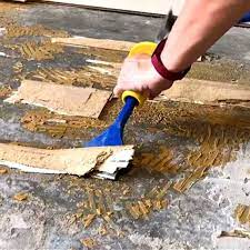 remove adhesive on concrete floors