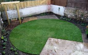 with circular lawn and sandstone paving