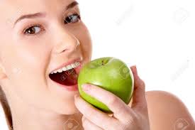 Designers also selected these stock photos. Portrait Of Pretty Girl With Open Mouth Eating Green Apple Stock Photo Picture And Royalty Free Image Image 6714289