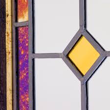 large purple gold framed stained glass