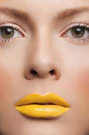 woman beauty with yellow lipstick by