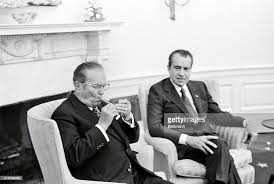 President Tito lighting a Cuban cigar ...