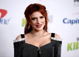 Bella Thorne posts topless photos of herself she says a hacker threatened  to release