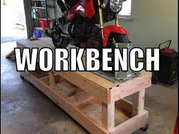 Chock is adjustable for width via a screw mechanism, while the lifting force is provided by a floor jack. How To Build A Motorcycle Workbench Youtube Motorcycle Lift Table Bike Stand Diy Diy Motorcycle