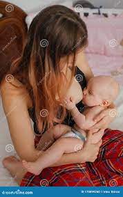 Young Mom Breastfeeding Her Newborn Child. Lactation Infant Concept. Mother  Feed Her Baby Son or Daughter with Breast Milk Stock Photo - Image of breast,  love: 170899260