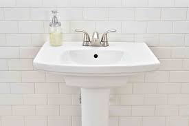 to hide plumbing behind pedestal sink