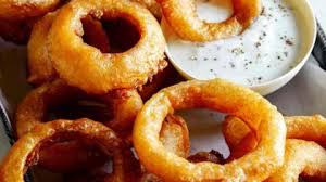 beer battered onion rings spoon fork