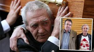 Birmingham Six member Paddy Hill carries the coffin of Gerry Conlon. Inset: The pair pictured together - gerry