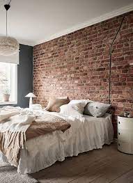 Blue Bedroom With An Exposed Brick Wall