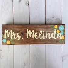 The two drawer pedestal accommodates hanging files and other materials, and a top drawer holds additional supplies. Teacher Desk Signs Lillou Handmade