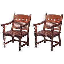 The most common teak dining chairs material is wood. Pair Of 1920s Solid Teak Wood Superbly Crafted Contoured Armchairs Wood Chair Design Wood Chair Colonial Furniture