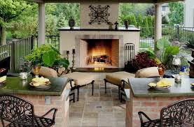 outdoor fireplace and an outdoor fire pit