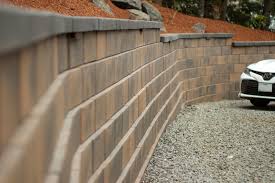 Segmental retaining wall base course installation. How To Build A Retaining Wall At Home Western Interlock
