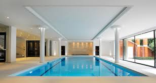 Windows, skylights and sliding glass doors are a great way to create an open feeling, but they can also lead to excessive heat in the summer. Indoor Swimming Pool Design Construction Falcon Pools