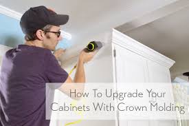 Attach the plates to the ceiling and wall with a nail gun into the studs. How To Add Crown Molding To The Top Of Your Cabinets Young House Love