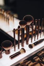 a set of makeup artist brushes on the stand