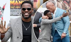Dwayne johnson's very first film role was playing. Kevin Hart Gets A Big Kiss From Co Star Dwayne The Rock Johnson During Hand And Footprint Ceremony Daily Mail Online