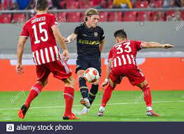 Antwerp's Viktor Fischer and Olympiacos' Michal Karbownik fight for the  ball during a soccer game between Greek Olympiacos F.C. and Belgian Royal  Antw Stock Photo - Alamy