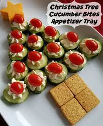 Having no ideas about the appetizers for christmas? Cucumber Bites Christmas Tree Appetizer Tray Cucumber Bites Xmas Food Best Christmas Appetizers